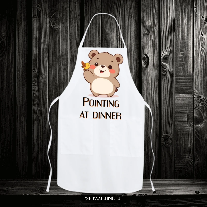 Funny apron with a happy bear pointing excitedly at a fluttering bird, ready to help cook.
