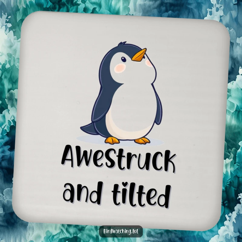Funny drink coaster with a wobbly penguin looking up at the sky with wonder, adding a decorative and humorous touch to tabletops.