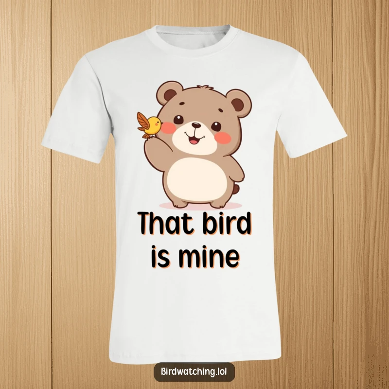 Funny t-shirt with a happy bear pointing enthusiastically at a delicate bird fluttering in the sky.